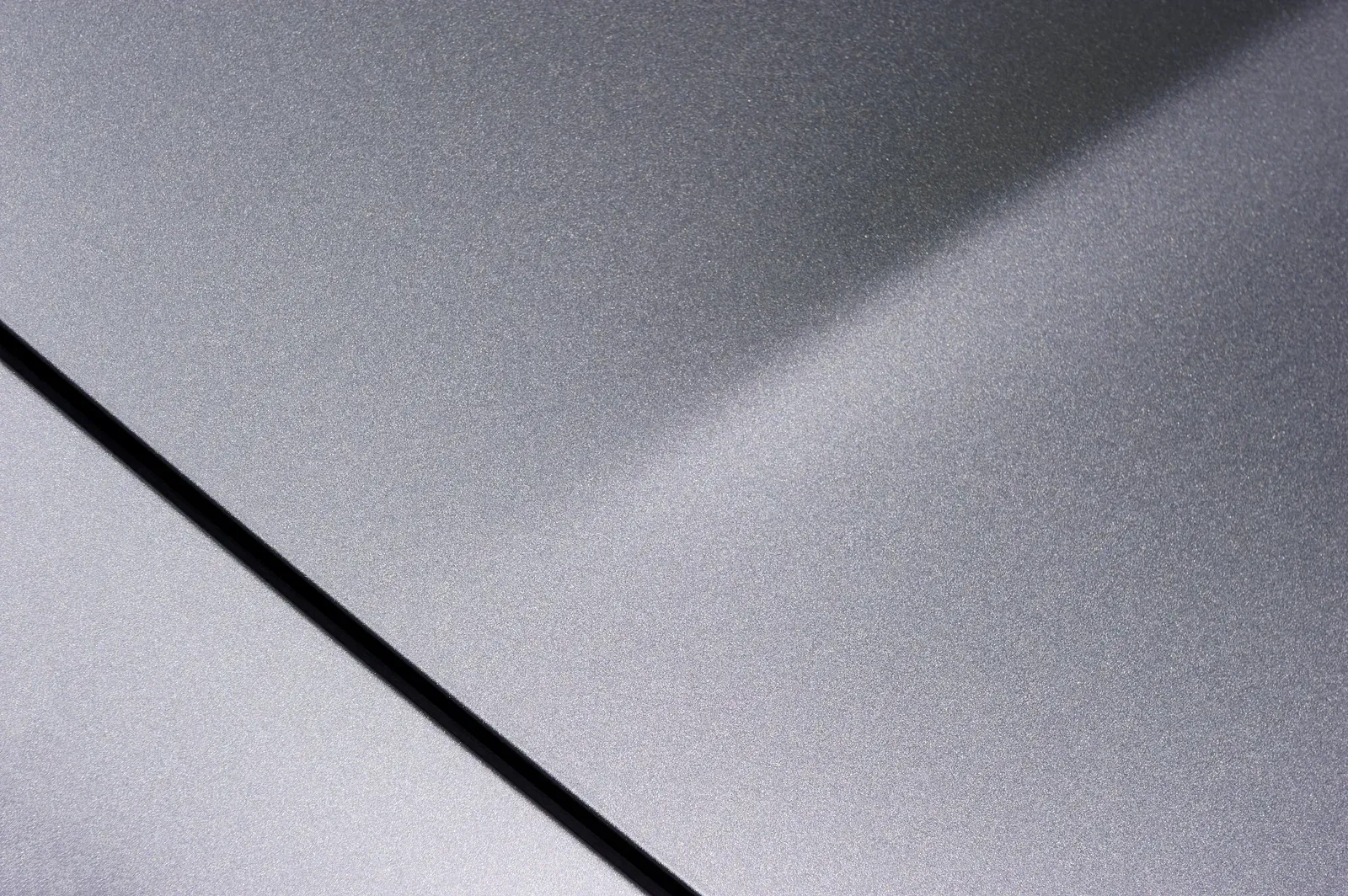 The same panel refinished to a factory-match metallic